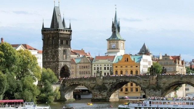 In which city can you cross the Charles Bridge?